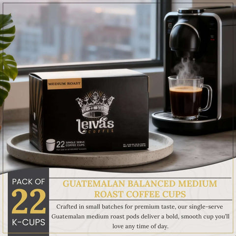 Box of Guatemalan Single Serve K Cups Coffee Pods 22 Count Medium Roast next to a Keurig coffee maker brewing coffee.
