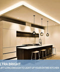 Modern kitchen with 32.8ft Warm White Dimmable LED Strip Lights Kit With Flexible Rope Design illuminating ceiling