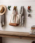 Set Of Six Slick Flying Bird Cast Iron Wall Hooks Featuring Hella Distressed Rustic Finish Decorative Mounted Hanging Hardware Perfect For Home Entryway Upgrades And Cozy Vintage Vibes displaying bags and scarves.