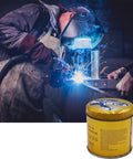 Anti Spatter Welding Nozzle Gel For MIG Nozzles And Tips Keeps Your Nozzle Clean Prevents Clogs And Erratic Operation Works In Any Position With Any Nozzle Odorless Non Flammable Non Toxic Silicon Free Compatible With Any Tip in a metal canister next to a welder using a MIG welder.