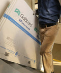 No Sweat Ultralight Shower Wall Panel Kit Three Foot X Five Foot Half Inch Boards being carried upstairs for installation.