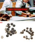 Forty Brass Flat Head Button Studs Feature Screw On Chicago Screws Ideal For Rugged Leather Belt Bag Shoes And Bookbinding Work Gives Badass Grip Quality With Slick Rust Shield Plating Comes In 5 6 5 And 8 Mm Fits 5mm size flat head rivets displayed on a work table.
