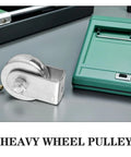 Beefed Up Heavy Duty Fixed Hoist Pulley With Single Wheel For Wire Rope Lifting And Industrial Towing Applications Steel Rigging Pulley 300 Kg Capacity Low Wear High Reliability displayed on a table beside green tool box.