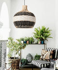 Boho Rattan Pendant Light for Kitchen Island Handmade Woven Chandelier in Black and White, displayed in coastal living room.
