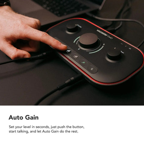 Hand adjusting Vocaster Two Podcasting Interface For Recording Host And Guest With Two Mic Inputs, shown with cables connected.