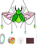 Stag Beetle Stained Glass Kit For Beginners With Pre Cut Pieces, solder wire, tools and finished suncatcher in green and pink.