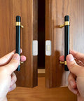 12 Pack No Drill Magnetic Cabinet Catches Ultra Thin Stainless Steel With Strong Adhesive For Kitchen Bathroom Closet And Rv Door Catching Solutions shown being installed on cabinet doors.