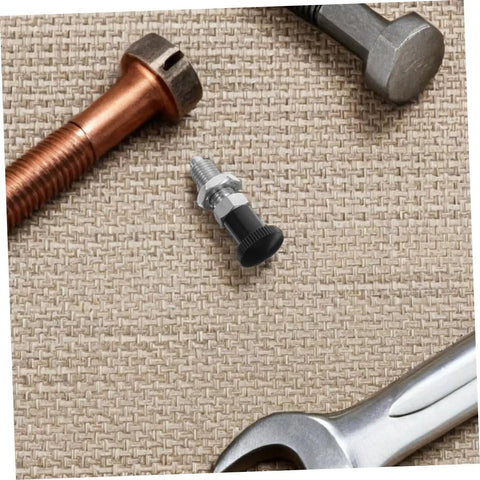 Heavy Duty Stainless Steel Reset Spring Indexing Plunger With Knockout Self Locking Grip for Precision Shop Tools on a textured surface.