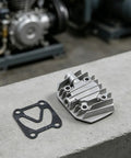 Oil-Free Silent Cast Aluminum Air Compressor Cylinder Head Replacement Part with gasket on concrete surface