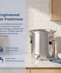 Straight Up Heavy Duty 304 Stainless Steel Beverage Dispenser With Easy Flow Spigot, Airtight Food Storage Container For Liquids And Bulk Grains, Top Shelf Kitchen Workhorse on a countertop.