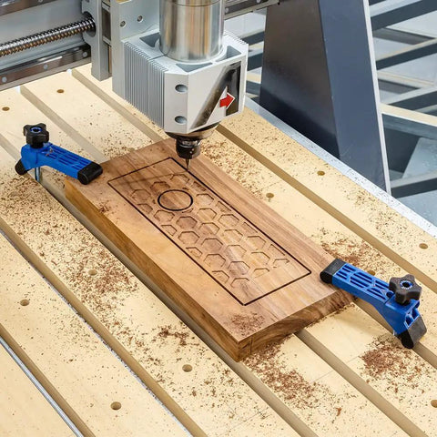 CNC router using blue Bit Saver Hold Down Clamps For CNC Routers, Five And A Half Inch Long By One And A Quarter Inch Wide, Two Pack