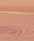 A close-up view of smooth wood grain on an Aromatic Cedar Hardwood plank, featuring distinct patterns and tones.