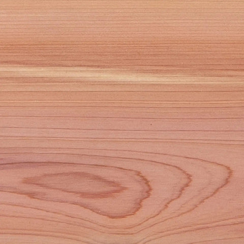 A close-up view of smooth wood grain on an Aromatic Cedar Hardwood plank, featuring distinct patterns and tones.