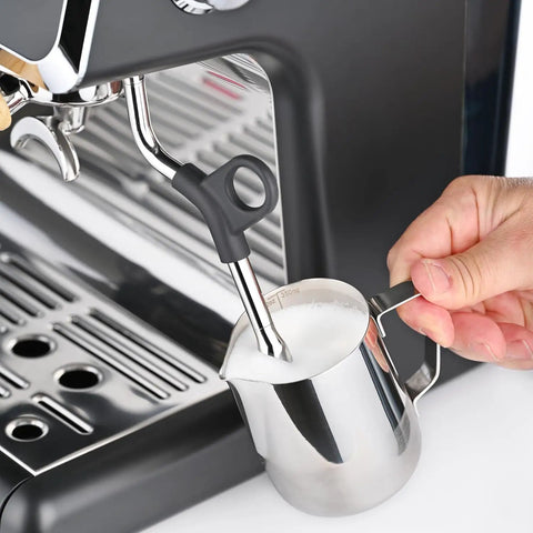 Fully Automatic Espresso Machine With Badass Burr Grinder And Hella Smooth Pulls Featuring Precise Temperature Control Plus Adjustable Milk Frother And Pro Grade 58mm Portafilter For Kitchen Ready Barista Coffee, steam wand in use with milk pitcher.