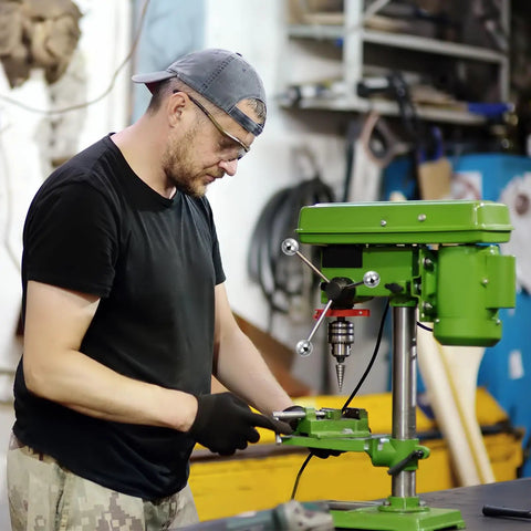 Man using machinery with 4 Pack Ball Nuts Knobs M8x1.25mm Thread 15mm Diameter 304 Stainless Steel in a workshop setting