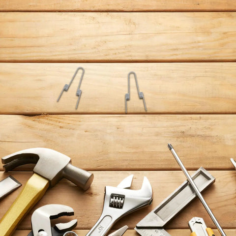 Ditch Your Wonky Flip Lid With These Rock Solid Stainless Steel Torsion Springs And Make DIY Repairs A Breeze For Any Trash Can In the Kitchen Or Home, two springs on wood