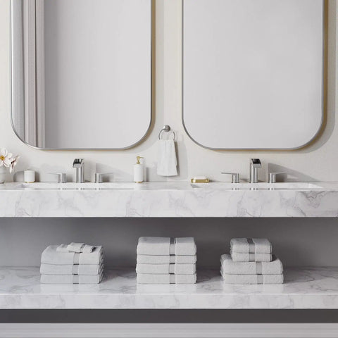 Brushed Nickel Waterfall Bathroom Faucet For Your Vanity Sink Widespread 3 Hole 8 Inch Design Solid 304 Stainless Steel Construction Includes Pop Up Drain And Water Supply Lines installed in a dual vanity with marble countertop.