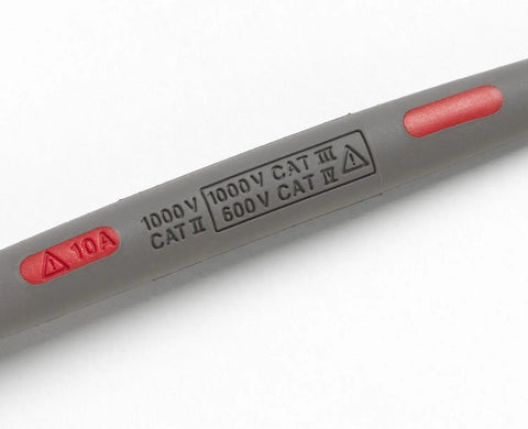 Close-up of Pro Grade Right Angle Test Lead Set With Comfort Grip Probes showing voltage and current ratings on the gray insulation.