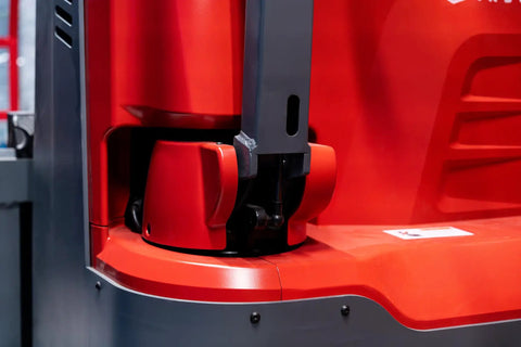 Close-up of the base of the Heavy Duty Fully Electric Adjustable Straddle Stacker, showing red and gray components.