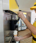 Person using ergonomic ice cream maker replacement handle grip lever fits most machines durable high temp part for ice cream
