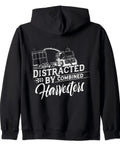 Easily Distracted By Combine Harvesters Zip Hoodie For Farmers And Harvest Lovers Farm Folk Gear Funny Threshing Hoodie Gift Idea For Christmas Or Birthday in black, back view with graphic.