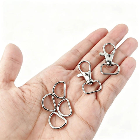 Hella Durable Zinc Alloy Swivel Snap Hooks And D Rings For Purse Hardware, Keychain Crafting, Sewing, 122 Piece Kit With Smooth Turn Clasps, Half Inch Opening, Total Breeze To Use displayed in hand.