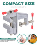 Portable Mini Bench Vice With Adjustable Table Clamp Vise For Precision Fixes, compact aluminum clamp with red handles.