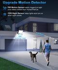 2 Pack Outdoor Solar Motion Lights With Remote illuminating driveway and garage, demonstrating motion sensor and range, night scene.
