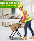 Person using All Steel Cable Caddy With Wheels Foldable Wire Spool Rack Holder Portable Reel Caddy 100 Pound Capacity in workshop