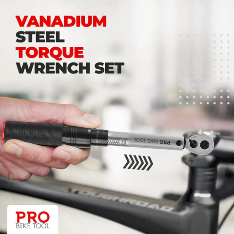 Hand using Pro Grade Bike Torque Wrench And Screwdriver Set For Your Ride Maintenance One Quarter Inch Drive Two Point Two To Sixteen Point Nine Newton Meters Includes Allen Torx Extension And Protective Case on bike parts.