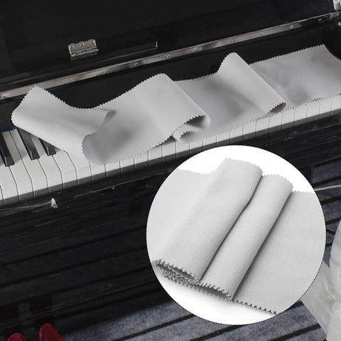 Gray velvet anti-dust cloth on piano keys, part of 2 Pack 88 Key Piano Keyboard Dust Covers Red And Gray Velvet Anti Dust Cloths For Digital Electric Pianos Upright Grand Pianos Protectors Set Soft Velvet Shield To Keep Debris Off While You Play.