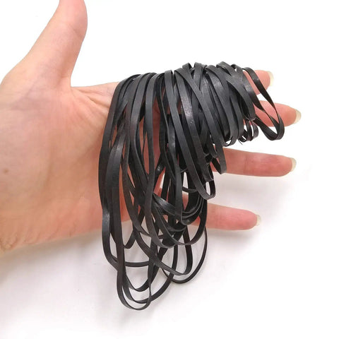 Hand holding black Flat Cassette Tape Player Drive Belts 3Mm Wide Universal Replacement Pack Of 50 Belts for devices repair