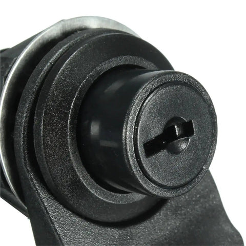Close-up of push button latch keyhole from Push Button Latch 2 Pack With Key For Motorcycle And Boat Glove Box Durable Plastic Quick Release Lock Marine Grade Storage Access Includes Gaskets And Mounting Rings No Fuss DIY Install In Upright Marine Box.