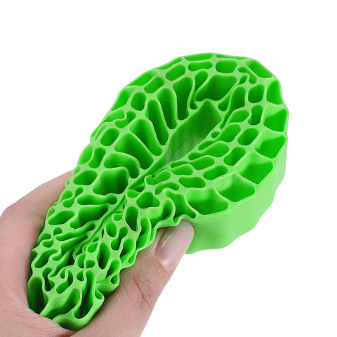 Green Silicone Rubber Insert For 118-122mm 4.75 Inch Outer Diameter RC Crawler Tires, waterproof, shown squeezed by hand.