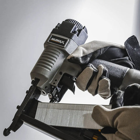 2 In 1 18 Gauge Pneumatic Brad Nailer And Narrow Crown Stapler for trim work and DIY projects, in gloved hands, close-up view