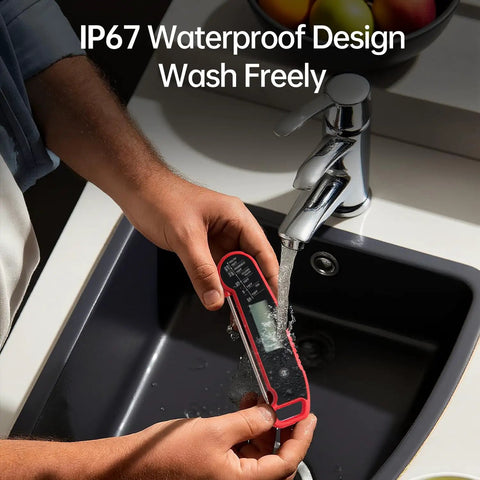 Person washing Digital Meat Thermometer For Cooking With Instant Read In Under One Second And Nine Tenths Fahrenheit Accuracy With Thermocouple Sensor IP67 Waterproof No Fuss Auto Rotating Display Auto Wake Up Red under running tap water demonstrating IP67 waterproof feature.