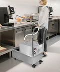 Heavy Duty Commercial Fryer Oil Filter Machine With Cart 55L Stainless Steel Storage Tank in a restaurant kitchen.