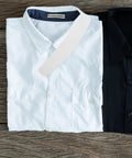 Ten Pack Plastic Collar Stays With White Tips For Mens Dress Shirts And Suits displayed on white and black dress shirts.