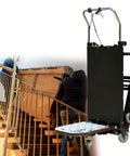 Heavy Duty Electric Stair Climbing Hand Truck Dolly With Foldable Toe Plate And Non Slip Rubber Tires moving a heavy load upstairs.