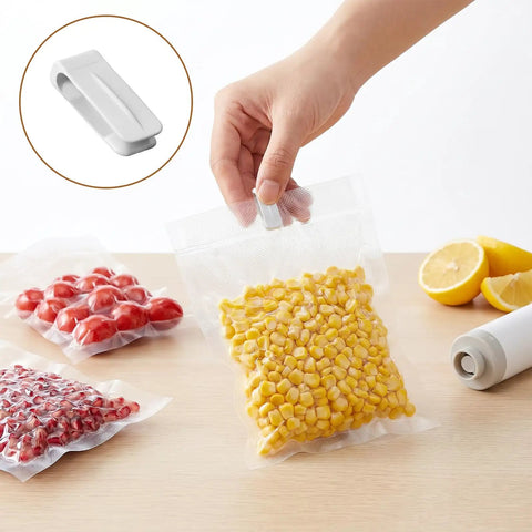 Person sealing corn in vacuum bag using 40 Pack Vacuum Storage Bag Sealing Clips With Sliding Grip Zipper Bag Sealer Labor Saver.