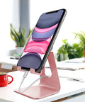 Rose Gold Adjustable Aluminum Phone Stand For All Phones With 270 Degree Tilt Case Friendly Clamp holding smartphone on desk