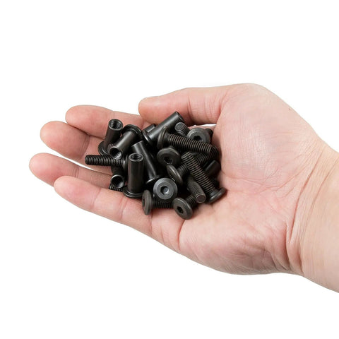 Hand holding 100 Pcs M6x25mm Furniture Bolts Hex Screws And Barrel Nuts Kit With 2 Matching Drive Tools For Furniture Connectors
