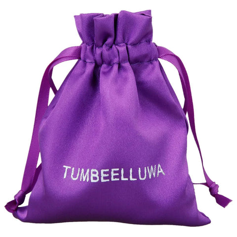 Purple drawstring bag labeled 'TUMBEELLUWA' for packaging Set Of 2 Crystal Stone T Bar Pull Handles With Screws In Brushed Brass Finish