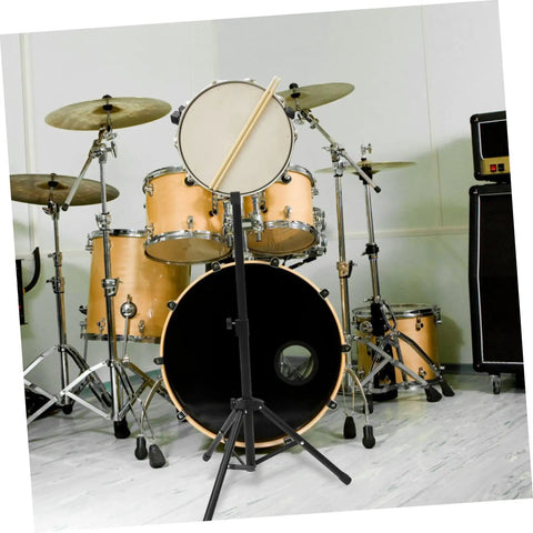 Badass Alloy Drum Holder Stand For Snare Practice Silent Support Rack with practice pad and drumsticks in music studio.