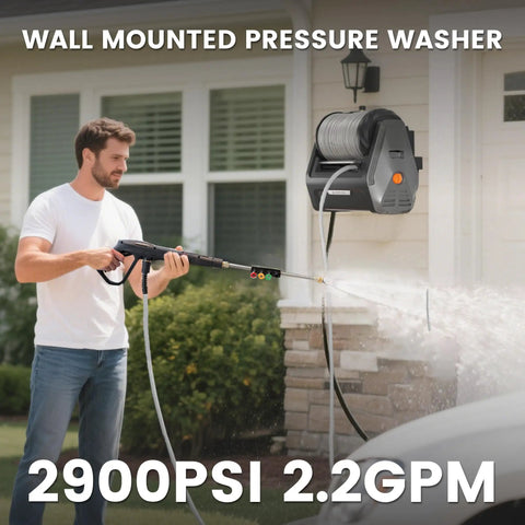 Person using Retractable Wall Mount Pressure Washer Pro Electric Power Cleaner With 2900 PSI 2.2 GPM 100 Ft Hose on house siding.