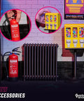 Rad Miniature Resin Fire Extinguisher 1/4 Scale Replica beside vibrant gumball machines in arcade-themed decor.