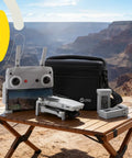 4K Drone With Camera, Dope 3 Axis Gimbal, GPS Auto Return on table in canyon setting, with controller and carrying case.