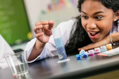 Child experimenting with Color Chemistry Kit With 50 Experiments For Kids STEM Science Toy For Boys And Girls Ages 7 8 9 Hands On
