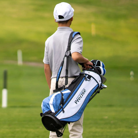 Child carrying Kid Friendly Junior Golf Set For Ages 9 To 12 With Driver Irons Putter Bag Pink on golf course