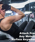 Woman using Heavy Duty Rugged Magnetic Phone Mount Holder with Hella Strong 50 Lbs Pull Force Magnet Clamp at the gym.
